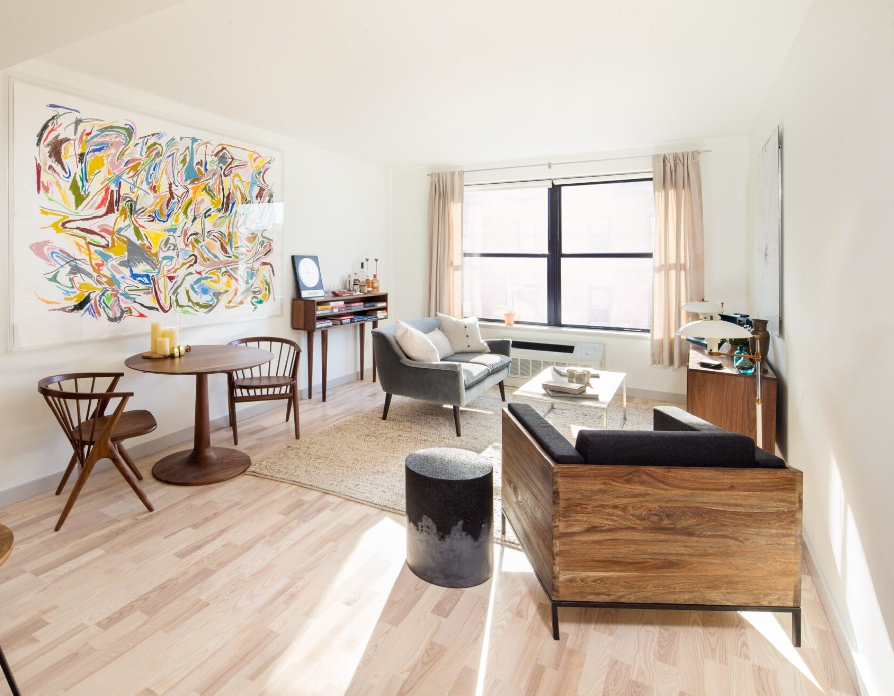 Living room with large windows and bright lighting