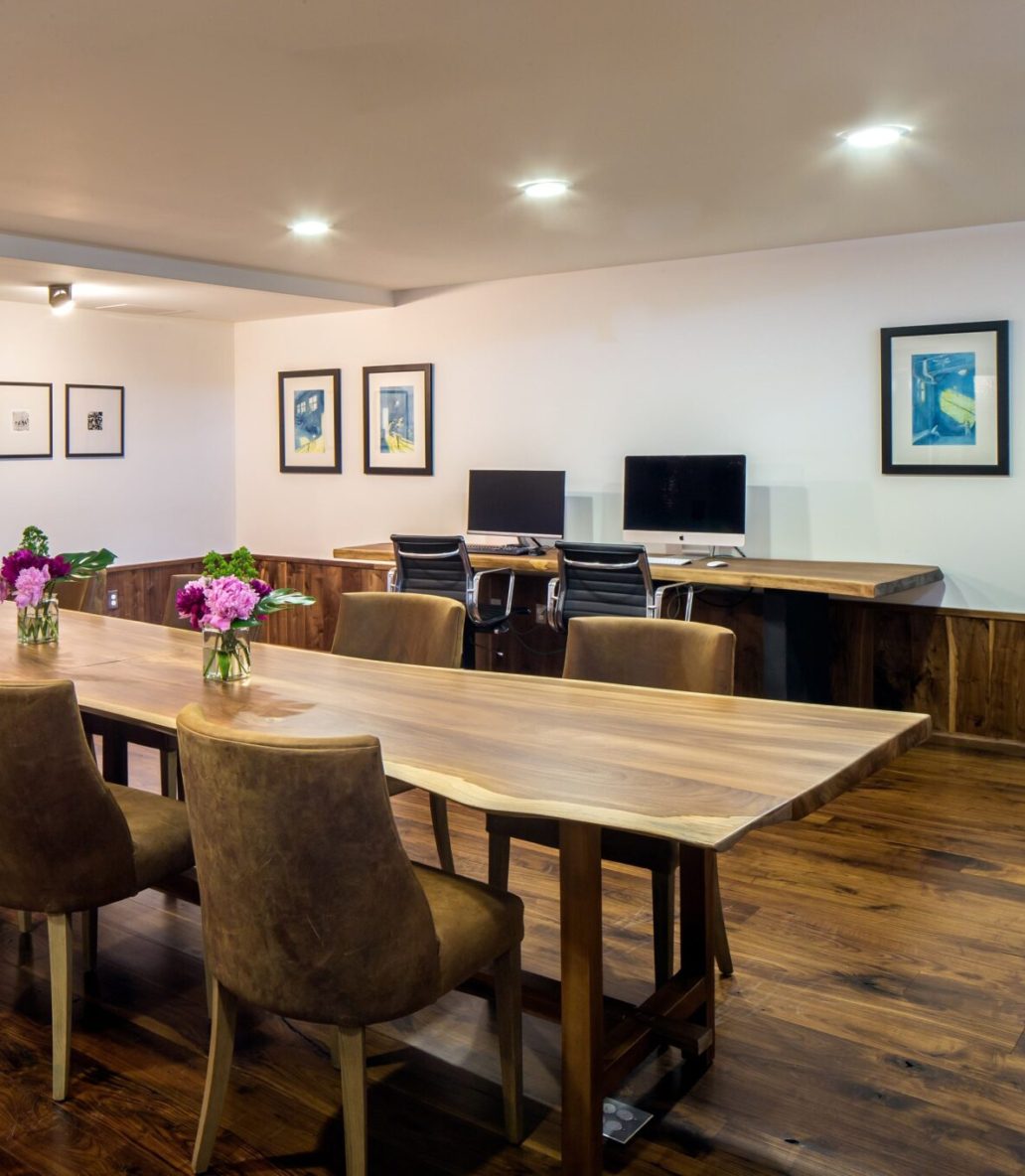 Business center with tables, seating, and computers